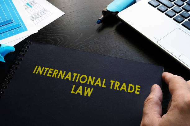 international trade law and notebook on a table.